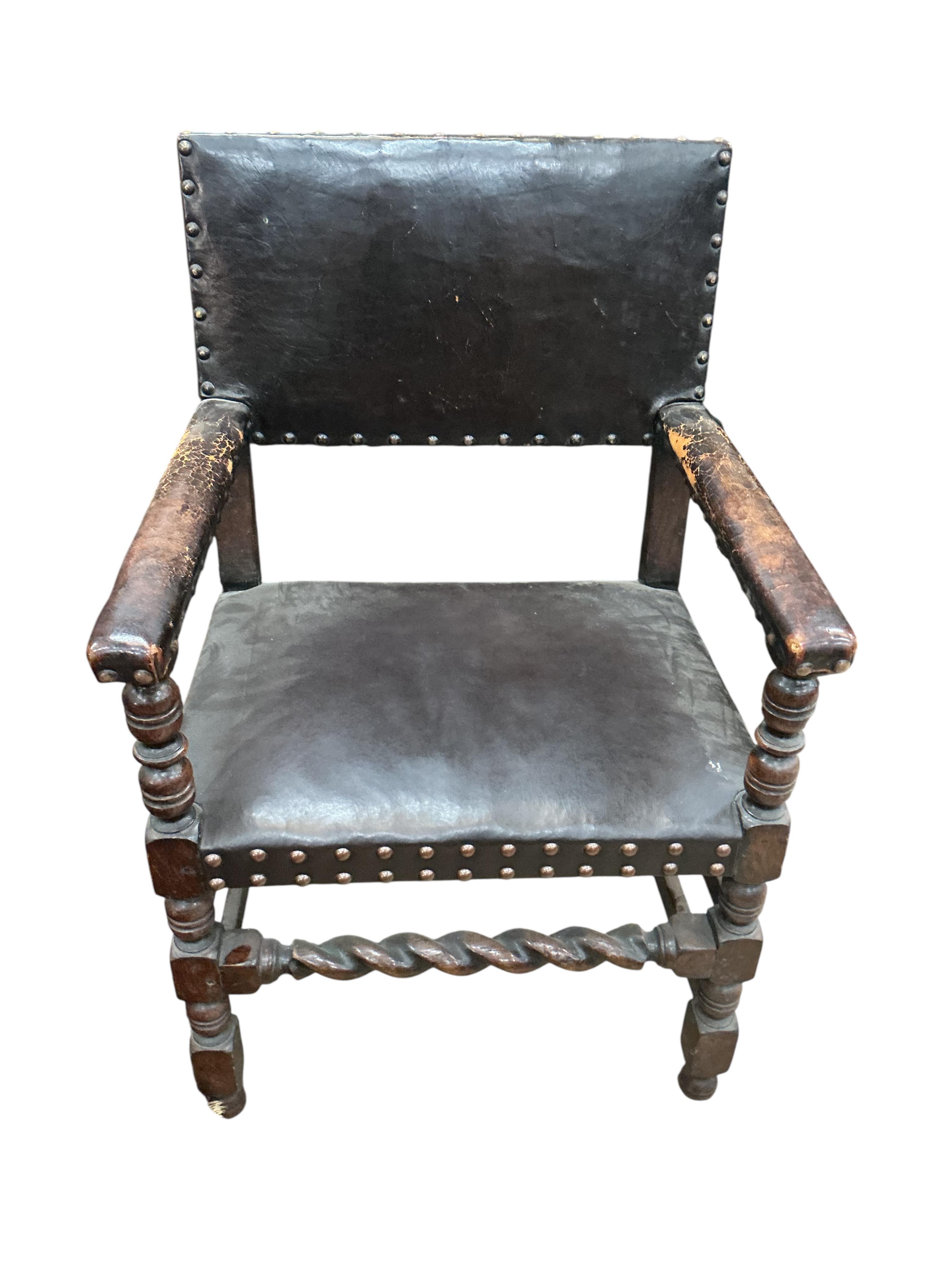 A set of eight Tudor style oak dining chairs, two with arms